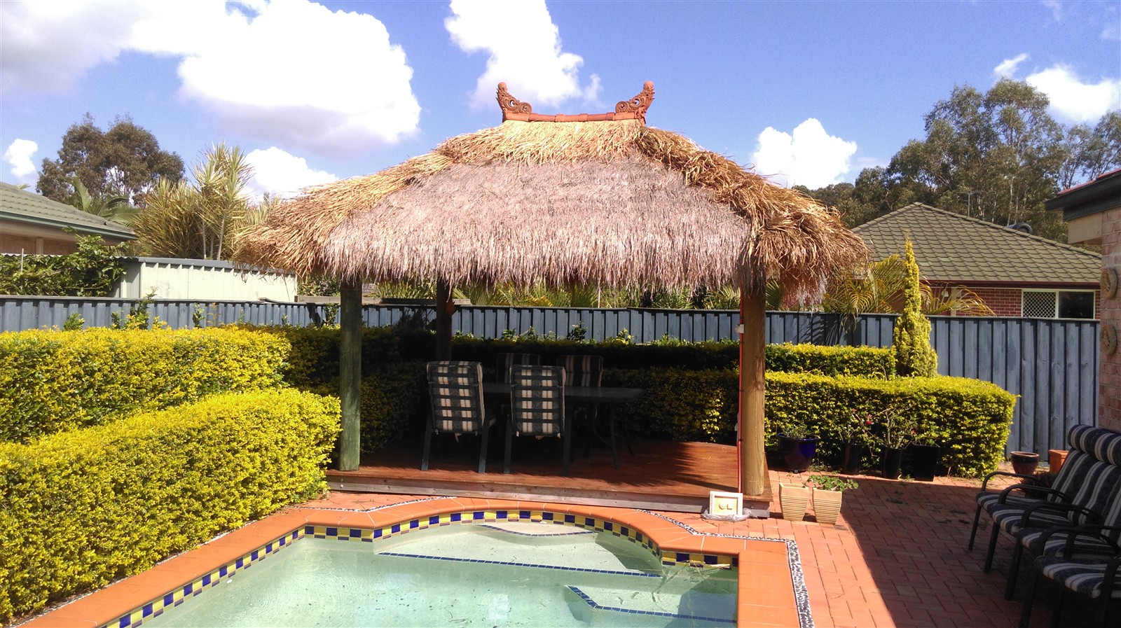 Poolside Bali hut with repaired mudbugs, ridge capping and finials