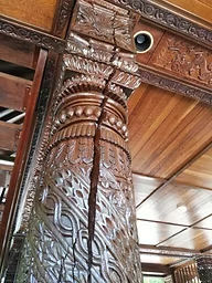 Carved timber column and roof detail at the Expo 88 Nepalese Peace Pergola