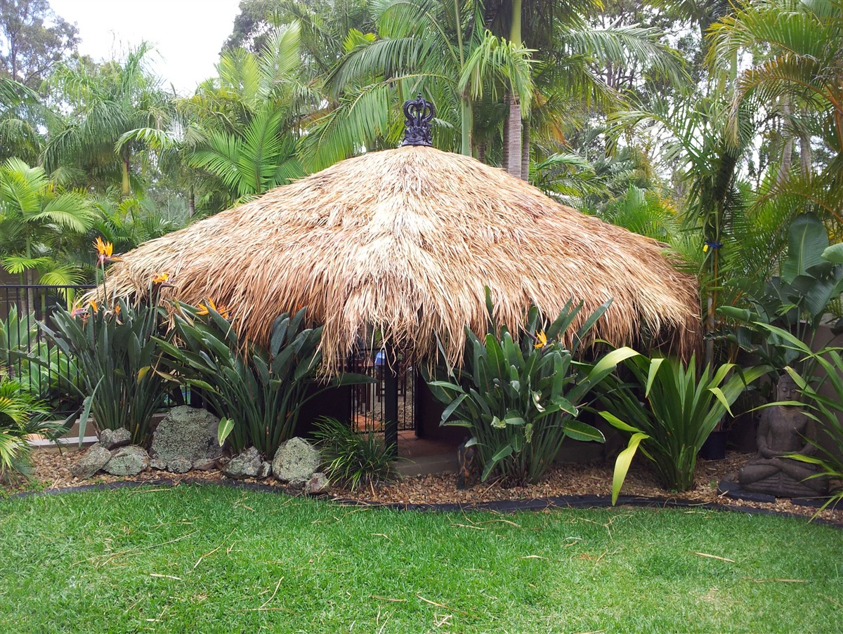 Garden pavilion upgraded with a natural Balinese thatch roof