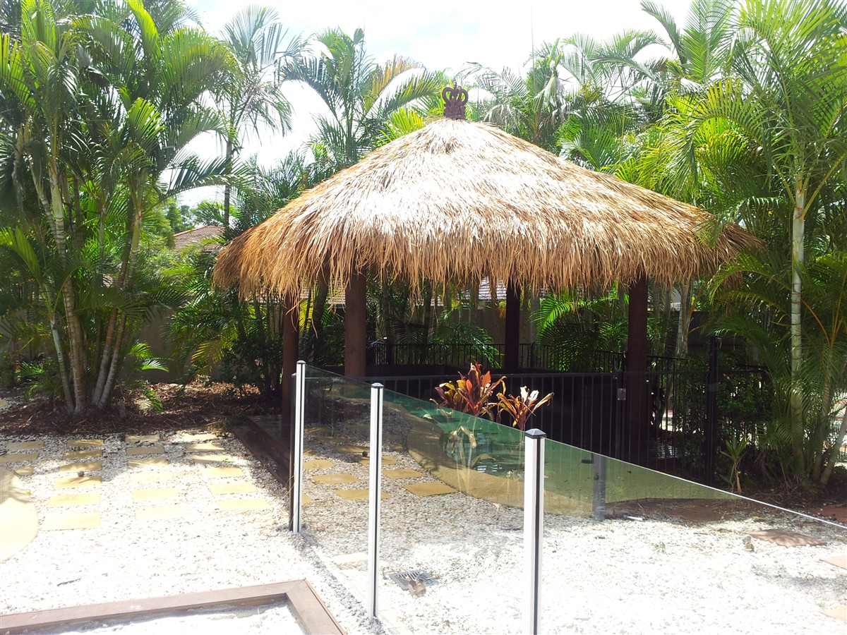Re-thatched Balinese hut beside a swimming pool