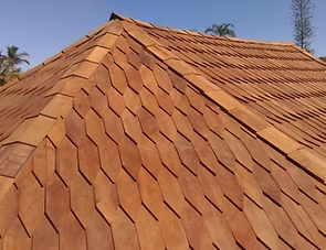 Diamond-pattern Tram-Wood shingles along a roof hip