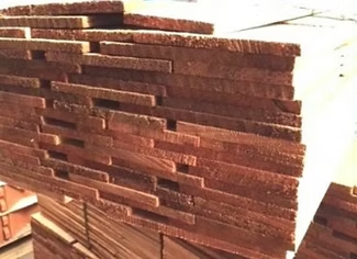 Stacked Canadian Red Cedar shingles showing their tapered edges